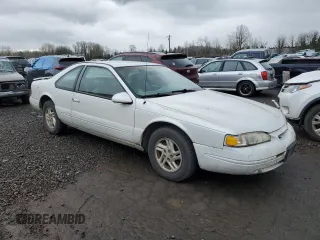1997 Ford Thunderbird LX with VIN 1FALP62W2VH154138, listed as a Copart auction lot 46281235 with 145,738 mi miles and Clean Title. Bid and sale history available at DreamBid. Image 4.