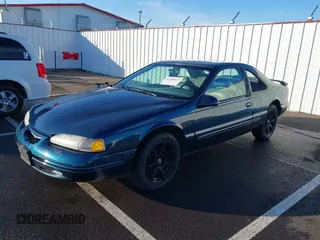 1996 Ford Thunderbird LX with VIN 1FALP62W1TH100925, listed as a IAAI auction lot 41289811 with 84,056 mi miles and . Bid and sale history available at DreamBid. Image 2.