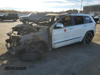 2013 Jeep Grand Cherokee Overland with VIN 1C4RJFCG5DC639401, listed as a Copart auction lot 79003094 with 0 mi miles and Salvage Title. Bid and sale history available at carsss.com. Image 1.