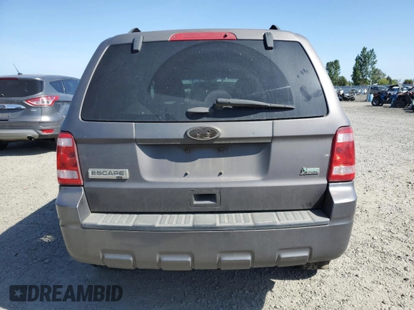 2011 Ford Escape XLT z VIN 1FMCU9DG7BKC39271, wystawiony jako Copart lot #55880445 z przebiegiem 202 072 mil mil oraz Szkoda całkowita • Salvage title. Historia ofert i sprzedaży dostępna na DreamBid. Obrazek 6.