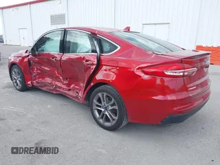 2020 Ford Fusion Hybrid Titanium with VIN 3FA6P0RU7LR156915, listed as a IAAI auction lot 40738652 with 82,836 mi miles. Bid and sale history available at carsss.com. Image 3.