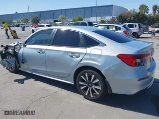2022 Honda Civic Sedan EX with VIN 2HGFE1F77NH309152, listed as a IAAI auction lot 42013565 with 25,474 mi miles. Bid and sale history available at carsss.com. Image 3.