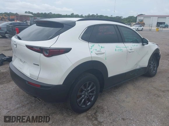 2023 Mazda CX-30 S with VIN 3MVDMBAM1PM511211, listed as a IAAI auction lot 42396707 with 49,469 mi miles and . Bid and sale history available at DreamBid. Image 4.