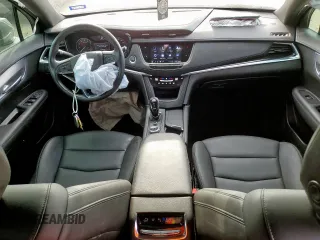 2024 Cadillac XT6 FWD Luxury with VIN 1GYKPAR41RZ700452, listed as a Copart auction lot 57675945 with 27,449 mi miles and Salvage title. Bid and sale history available at DreamBid. Image 8.