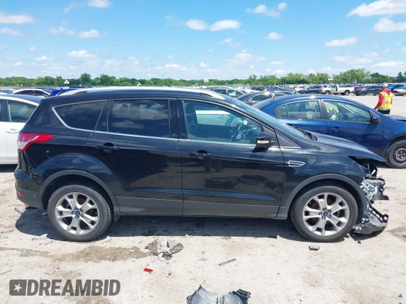 2015 Ford Escape Titanium with VIN 1FMCU0JX3FUB39808, listed as a IAAI auction lot 42212271 with 136,488 mi miles and . Bid and sale history available at DreamBid. Image 14.