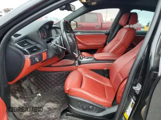 2014 BMW X6 M with VIN 5YMGZ0C56E0C40490, listed as a Copart auction lot 85317174 with 104,630 mi miles and Salvage Title. Bid and sale history available at carsss.com. Image 7.