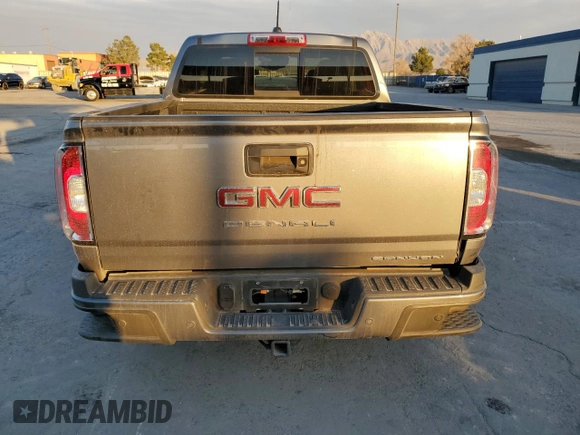 2021 GMC Canyon 4WD Denali with VIN 1GTG6EEN4M1130779, listed as a Copart auction lot 82695044 with 38,662 mi miles and Salvage Title. Bid and sale history available at carsss.com. Image 6.