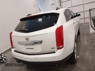 2012 Cadillac SRX Premium Collection z VIN 3GYFNFE38CS591123, wystawiony jako IAAI lot #41827636 z przebiegiem 143 867 mil mil oraz . Historia ofert i sprzedaży dostępna na DreamBid. Obrazek 17.
