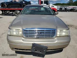 2000 Ford Crown Victoria with VIN 2FAFP73W0YX127395, listed as a Copart auction lot 72442494 with 123,999 mi miles and Salvage Title. Bid and sale history available at carsss.com. Image 5.