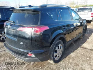 2018 Toyota RAV4 LE with VIN 2T3BFREV8JW706999, listed as a IAAI auction lot 41863485 with 115,589 mi miles. Bid and sale history available at carsss.com. Image 4.