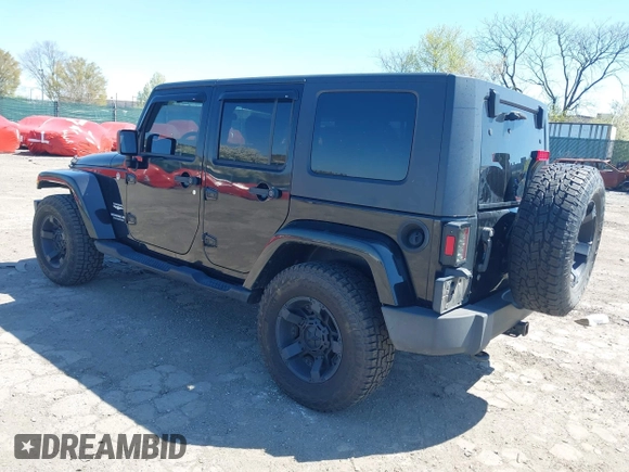2010 Jeep Wrangler Unlimited Sahara with VIN 1J4HA5H17AL140941, listed as a IAAI auction lot 42004203 with 126,100 mi miles. Bid and sale history available at carsss.com. Image 3.