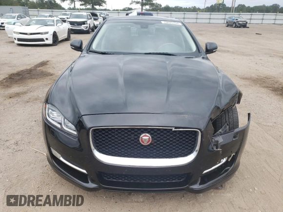 2017 Jaguar XJ with VIN SAJWA1C73H8W10544, listed as a Copart auction lot 70025724 with 64,437 mi miles and Salvage Title. Bid and sale history available at carsss.com. Image 5.