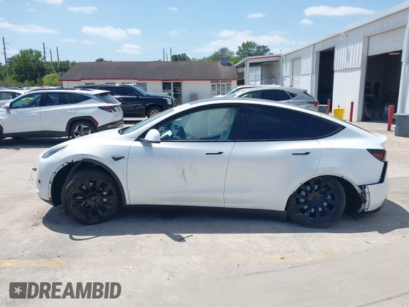 2023 Tesla Model Y Long Range with VIN 7SAYGDEE7PF865539, listed as a IAAI auction lot 42109673 with 34,923 mi miles and . Bid and sale history available at DreamBid. Image 14.
