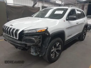 2015 Jeep Cherokee Trailhawk with VIN 1C4PJMBS1FW665500, listed as a IAAI auction lot 42068268 with 127,246 mi miles. Bid and sale history available at carsss.com. Image 2.