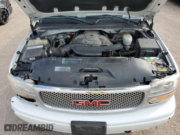 2005 GMC Sierra Denali z VIN 2GTEK63N551215749, wystawiony jako Copart lot #71357594 z przebiegiem 183 483 mil mil oraz Szkody całkowita. Historia ofert i sprzedaży dostępna na DreamBid. Obrazek 11.