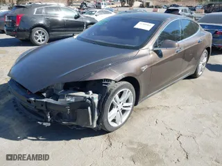 2013 Tesla Model S with VIN 5YJSA1DN4DFP19552, listed as a IAAI auction lot 41360466 with 129,806 mi miles. Bid and sale history available at carsss.com. Image 2.
