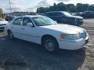 1999 Lincoln Town Car Signature with VIN 1LNHM82W0XY710627, listed as a IAAI auction lot 42440024 with 268,639 mi miles and . Bid and sale history available at DreamBid. Image 1.
