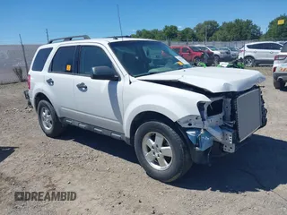 2012 Ford Escape XLT with VIN 1FMCU9DG9CKA09099, listed as a IAAI auction lot 40371699 with 136,707 mi miles and . Bid and sale history available at DreamBid. Image 1.