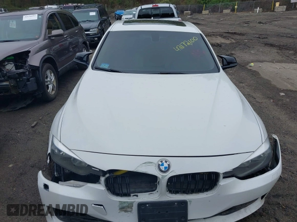 2014 BMW 3 Series 328i xDrive with VIN WBA3B5C56EP544400, listed as a IAAI auction lot 42172100 with 242,472 mi miles. Bid and sale history available at carsss.com. Image 12.