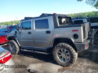2005 Hummer H2 SUT with VIN 5GRGN22UX5H106653, listed as a IAAI auction lot 42015559 with 180,519 mi miles. Bid and sale history available at carsss.com. Image 14.