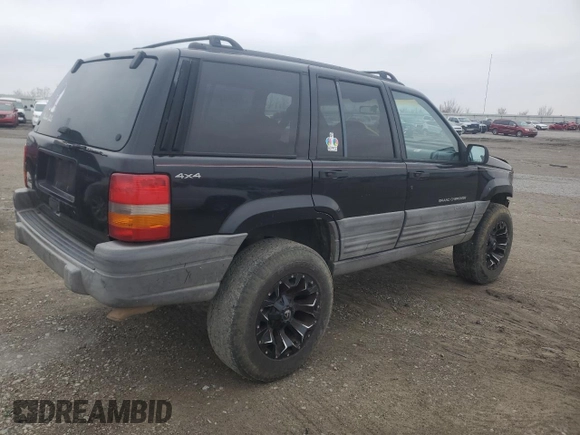 1998 Jeep Grand Cherokee Laredo with VIN 1J4GZ58S2WC281923, listed as a Copart auction lot 44010885 with 210,959 mi miles and Salvage Title. Bid and sale history available at carsss.com. Image 3.