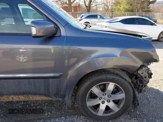2014 Honda Pilot Touring with VIN 5FNYF4H95EB019048, listed as a IAAI auction lot 41526958 with 172,252 mi miles and . Bid and sale history available at DreamBid. Image 19.