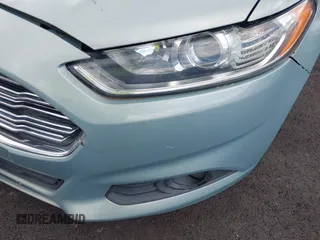 2014 Ford Fusion SE Hybrid with VIN 3FA6P0LU7ER154559, listed as a IAAI auction lot 42198548 with 244,630 mi miles. Bid and sale history available at carsss.com. Image 6.
