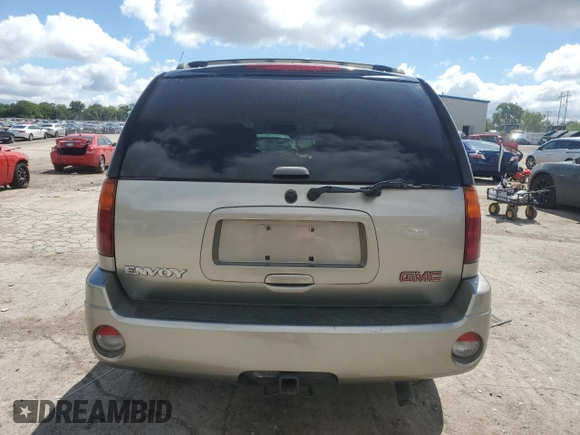2002 GMC Envoy SLT z VIN 1GKDS13S722253150, wystawiony jako Copart lot #56255185 z przebiegiem 174 198 mil mil oraz Szkoda całkowita • Salvage title. Historia ofert i sprzedaży dostępna na DreamBid. Obrazek 6.