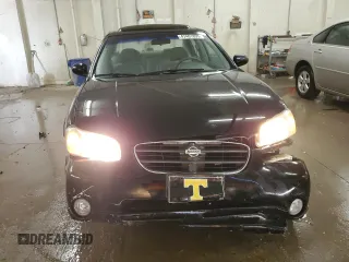2000 Nissan Maxima GXE z VIN JN1CA31A1YT211725, wystawiony jako Copart lot #47401895 z przebiegiem 122 228 mil mil oraz Szkody całkowita. Historia ofert i sprzedaży dostępna na DreamBid. Obrazek 5.