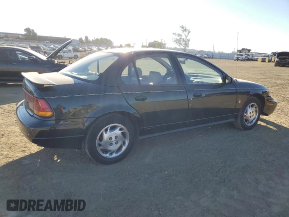 1996 Saturn SL z VIN 1G8ZK527XTZ335205, wystawiony jako Copart lot #42230735 z przebiegiem 82 344 mil mil oraz Szkoda całkowita • Salvage title. Historia ofert i sprzedaży dostępna na DreamBid. Obrazek 3.