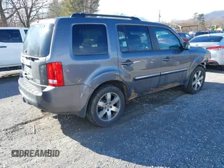 2014 Honda Pilot Touring with VIN 5FNYF4H95EB019048, listed as a IAAI auction lot 41526958 with 172,252 mi miles and . Bid and sale history available at DreamBid. Image 4.