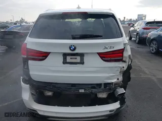 2018 BMW X5 xDrive40e iPerformance with VIN 5UXKT0C58J0V99415, listed as a IAAI auction lot 41391474 with 124,671 mi miles. Bid and sale history available at carsss.com. Image 17.