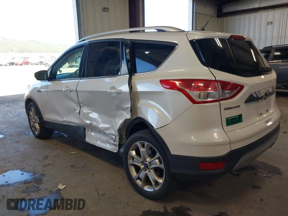2016 Ford Escape Titanium with VIN 1FMCU9J94GUC28648, listed as a IAAI auction lot 42043761 with 82,509 mi miles and . Bid and sale history available at DreamBid. Image 3.