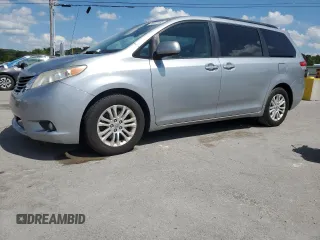 2014 Toyota Sienna XLE with VIN 5TDYK3DC3ES473978, listed as a Copart auction lot 64891185 with 201,658 mi miles and Salvage title. Bid and sale history available at DreamBid. Image 1.