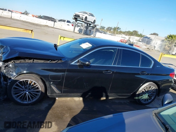 2019 BMW 5 Series 530e with VIN WBAJA9C57KB399541, listed as a IAAI auction lot 41656775 with 96,523 mi miles and . Bid and sale history available at DreamBid. Image 14.