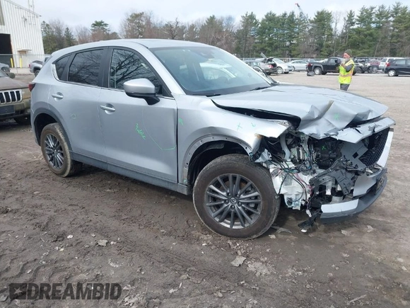 2021 Mazda CX-5 Touring with VIN JM3KFBCM9M1329806, listed as a IAAI auction lot 41825123 with 59,300 mi miles. Bid and sale history available at carsss.com. Image 1.