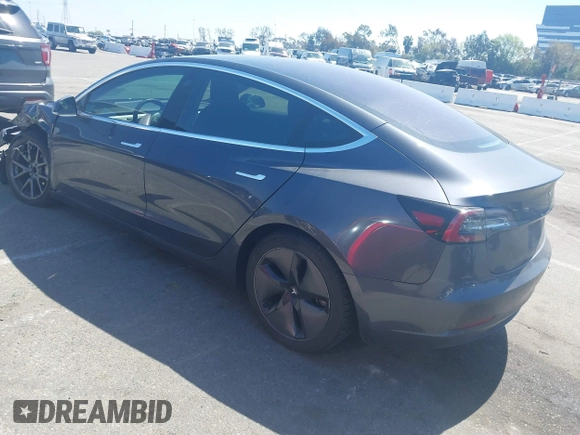 2018 Tesla Model 3 Long Range Battery z VIN 5YJ3E1EA9JF042319, wystawiony jako IAAI lot #41871931 z przebiegiem 138 837 mil mil oraz . Historia ofert i sprzedaży dostępna na DreamBid. Obrazek 3.
