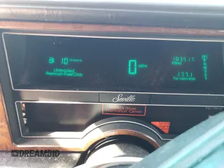 1991 Cadillac Seville z VIN 1G6KS53B9MU824142, wystawiony jako Copart lot #74276264 z przebiegiem 103 517 mil mil oraz Szkody całkowita. Historia ofert i sprzedaży dostępna na DreamBid. Obrazek 9.