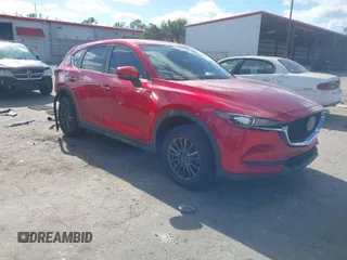 2020 Mazda CX-5 Sport with VIN JM3KFABM7L1819493, listed as a IAAI auction lot 41304240 with 52,940 mi miles. Bid and sale history available at carsss.com. Image 1.