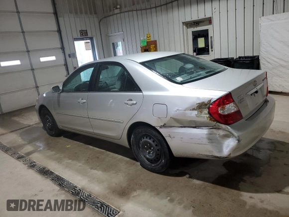 2002 Toyota Camry LE z VIN 4T1BE32K32U063577, wystawiony jako Copart lot #58782185 z przebiegiem 243 589 mil mil oraz Szkoda całkowita • Salvage title. Historia ofert i sprzedaży dostępna na DreamBid. Obrazek 2.