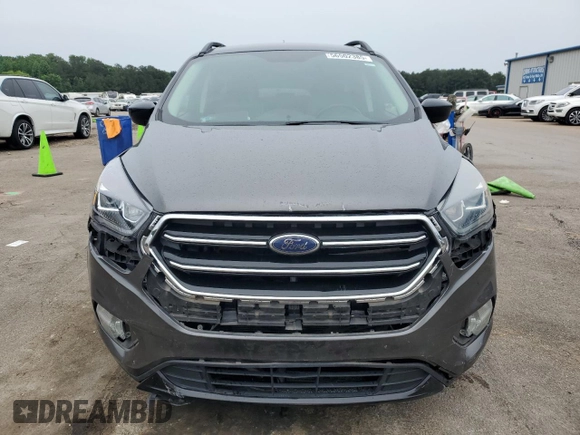 2017 Ford Escape SE z VIN 1FMCU9GD1HUB35003, wystawiony jako Copart lot #56502385 z przebiegiem 74 409 mil mil oraz Szkoda całkowita • Salvage title. Historia ofert i sprzedaży dostępna na DreamBid. Obrazek 5.