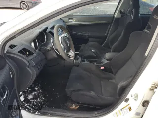 2010 Mitsubishi Lancer Evolution GSR with VIN JA32W8FV4AU604717, listed as a Copart auction lot 83896464 with 140,502 mi miles and Salvage Title. Bid and sale history available at DreamBid. Image 7.