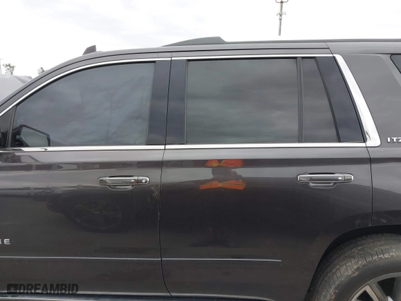 2015 Chevrolet Tahoe LTZ with VIN 1GNSCCKC7FR614886, listed as a IAAI auction lot 41679585 with 104,695 mi miles. Bid and sale history available at carsss.com. Image 14.