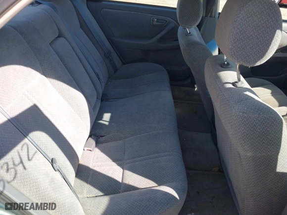 2000 Toyota Camry CE with VIN 4T1BG22KXYU730531, listed as a IAAI auction lot 42003342 with 248,235 mi miles. Bid and sale history available at carsss.com. Image 8.
