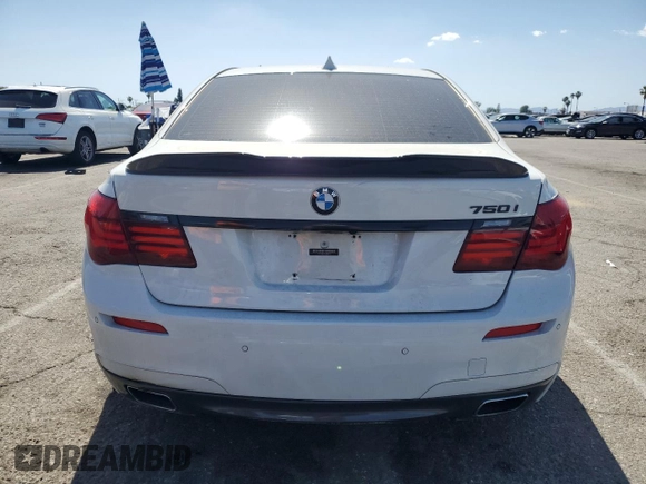 2013 BMW 7 Series 750i with VIN WBAYA8C54DC996412, listed as a Copart auction lot 56982895 with 124,258 mi miles and Salvage title. Bid and sale history available at DreamBid. Image 6.