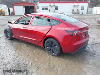 2024 Tesla Model 3 with VIN 5YJ3E1EA7RF869098, listed as a IAAI auction lot 41477093 with 3,869 mi miles. Bid and sale history available at carsss.com. Image 3.