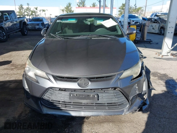 2016 Scion tC with VIN JTKJF5C78GJ014184, listed as a IAAI auction lot 41622575 with 128,520 mi miles. Bid and sale history available at carsss.com. Image 12.