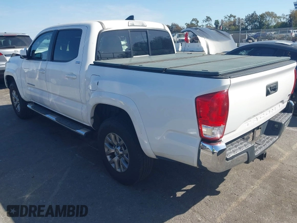 2017 Toyota Tacoma SR5 with VIN 5TFAZ5CN9HX039333, listed as a IAAI auction lot 41701962 with 102,737 mi miles and . Bid and sale history available at carsss.com. Image 3.