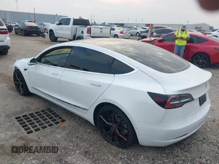 2019 Tesla Model 3 Mid Range with VIN 5YJ3E1EA8KF472540, listed as a IAAI auction lot 41661312 with 75,575 mi miles and . Bid and sale history available at DreamBid. Image 3.