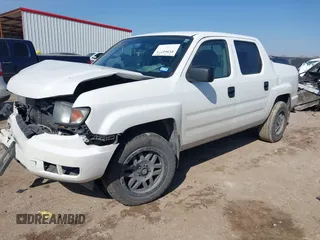 2014 Honda Ridgeline Sport with VIN 5FPYK1F78EB011254, listed as a IAAI auction lot 41564771 with 151,741 mi miles and . Bid and sale history available at DreamBid. Image 2.